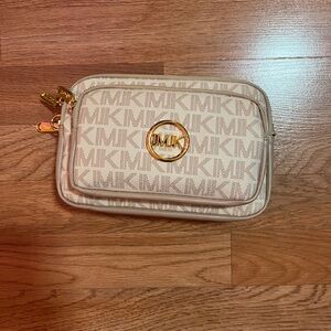 Tab and gold handbag